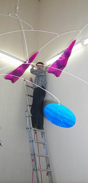 David hanging a large mobile